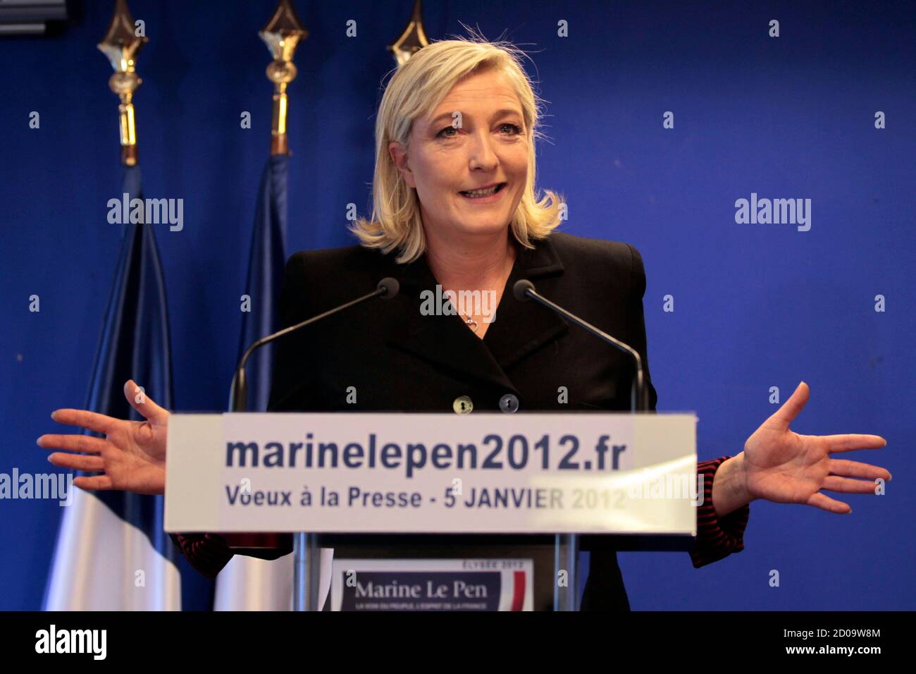 Marine Le Pen, France's National Front head and candidate for the 2012  French president election, gestures as she delivers a speech to present her  New Year wishes to the media in Nanterre
