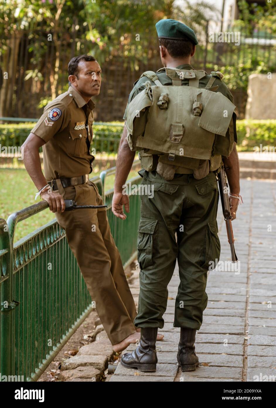 Kandy, Sri Lanka - 09-03-24 - Sri Lanka Military Stands Guard In Temple. Stock Photo