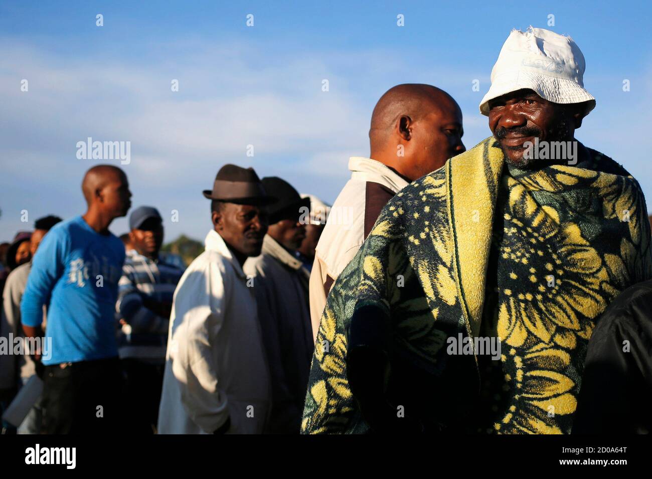 Locals wait to cast their votes during Lesotho's national elections in Magkhoakhoeng village, outside the capital Maseru, February 28, 2015. Feuding parties in Lesotho's ruling coalition will face off on Saturday in early national elections staged in a bid to restore stability six months after an attempted coup.The vote is being held about two years ahead of schedule under a political deal brokered by South Africa, which surrounds the mountainous kingdom. REUTERS/Siphiwe Sibeko (LESOTHO - Tags: POLITICS ELECTIONS) Stock Photo