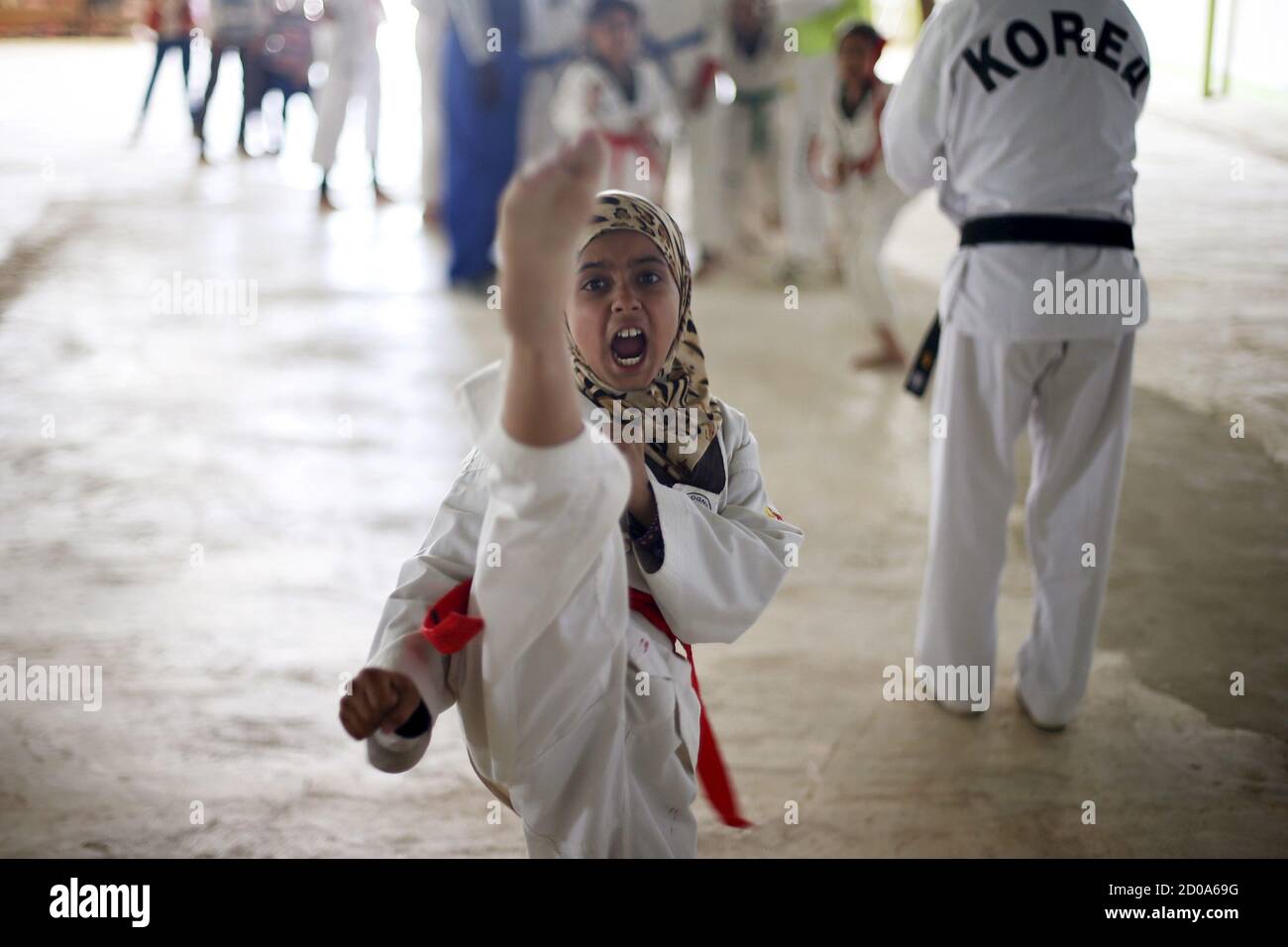 Syrian refugee girls undergo training in the Korean Taekwondo Academy For  Syrian Children at the Al Zaatari refugee camp in the Jordanian city of  Mafraq, near the border with Syria March 24,