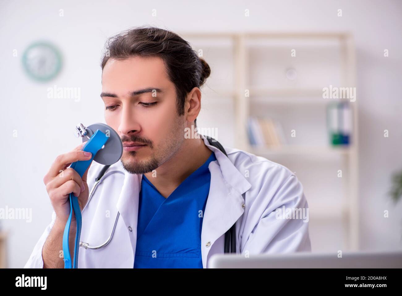 Young male doctor working in the clinic hospital Stock Photo - Alamy