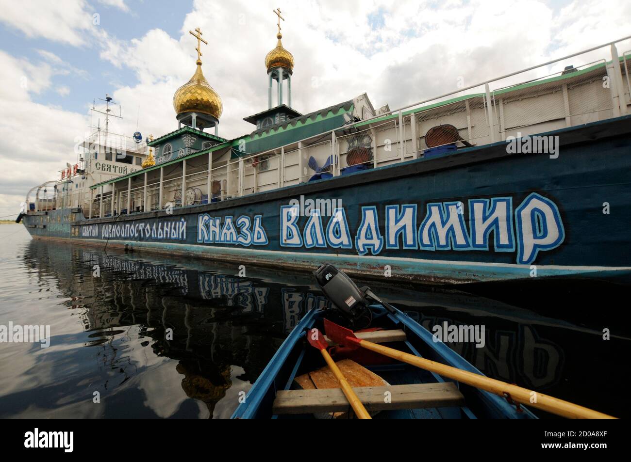 The Saint Vladimir floating Orthodox Christian temple is seen tied up at a mooring on the Volga river in the southern city of Volgograd May 10, 2011. The self-propelled ship-temple which bears the full name 'Grand Prince St. Vladimir, Equal-to-the-Apostles' was reconstructed on the base of a landing ship and christened October 31, 2004, according to its builders.  REUTERS/Sergei Karpov  (RUSSIA - Tags: RELIGION SOCIETY ODDLY TRANSPORT) Stock Photo