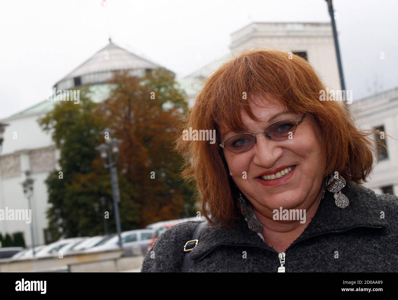 Anna Grodzka, from a newly formed liberal party called Palikot's Support Movement, smiles outside Poland's parliament in Warsaw October 12, 2011. Grodzka, the first transsexual to win a seat in Poland's parliament, said on Monday she was on a mission to help Poles in this staunchly Roman Catholic country to improve the understanding of problems facing people who have changed their gender. REUTERS/Peter Andrews (POLAND - Tags: ELECTIONS POLITICS HEADSHOT) Stock Photo