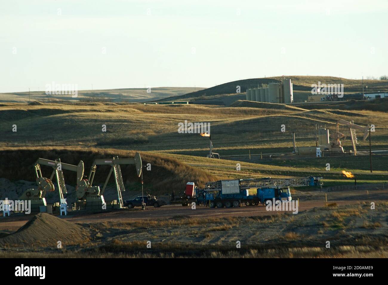 Multiple oil well sites are seen on the Fort Berthold Indian Reservation in North Dakota, in a November 1, 2014 file photo. The Fort Berthold Indian Reservation, home to the Mandan, Hidatsa, and Arikara Nation, produces nearly a third of North Dakota's oil. Officials on an American Indian reservation where roughly a third of North Dakota's oil is extracted tell Reuters they may walk away from a tax-sharing agreement with the state government, a step that could wreak havoc on the energy industry by creating dueling levy rates. If no agreement can be reached, EOG Resources Inc, Marathon Oil Co a Stock Photo