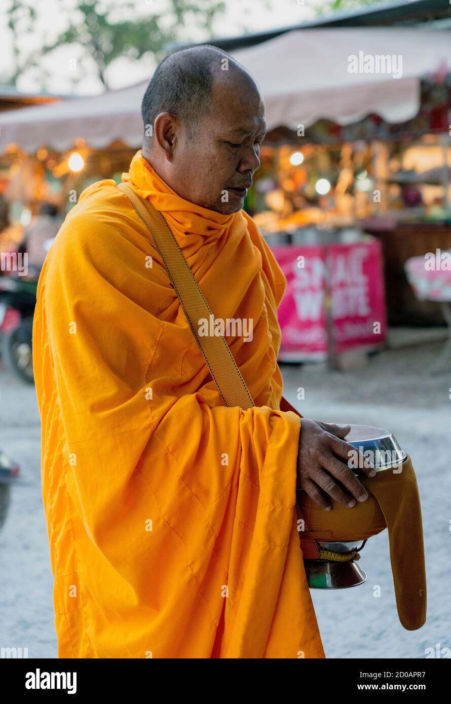 Sukhothai, Tahiland - 2019-03-06 - Monk Walks Asking for Alms. Stock Photo