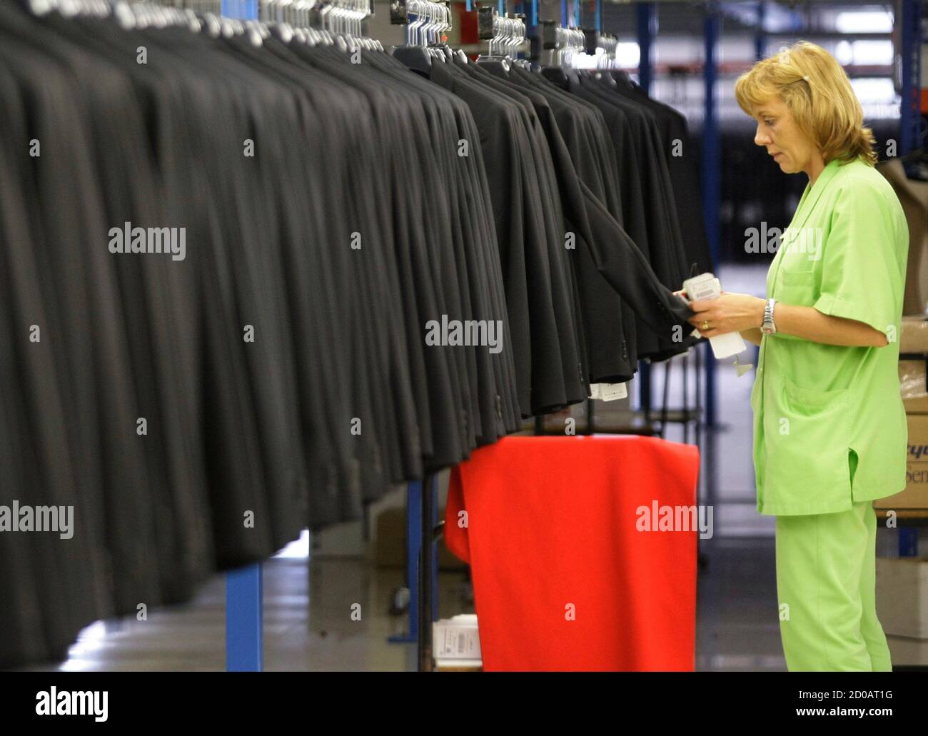 A woman works at the Zara factory at the headquarters of Inditex group in  Arteixo, northern Spain, July 15, 2011. The green, rainy region of Galicia  in northwest Spain is best-known as