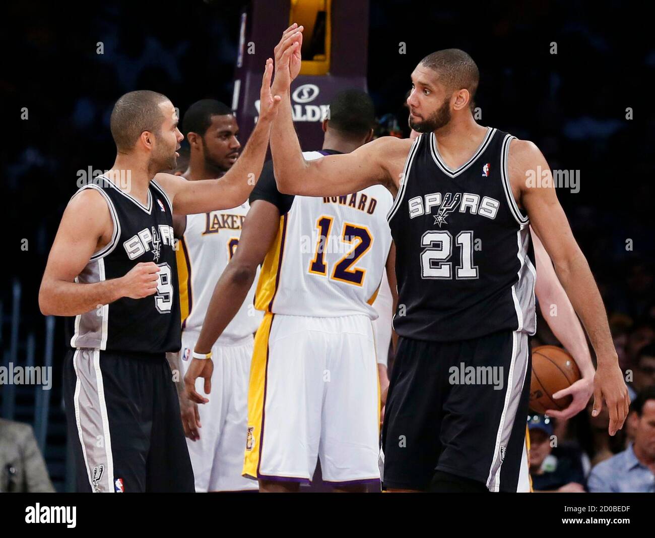 San Antonio Spurs power forward Tim Duncan (21) slaps hands with teammate,  guard Tony Parker (9) during Game 4 of their NBA Western Conference  Quarterfinals basketball playoff series against the Los Angeles
