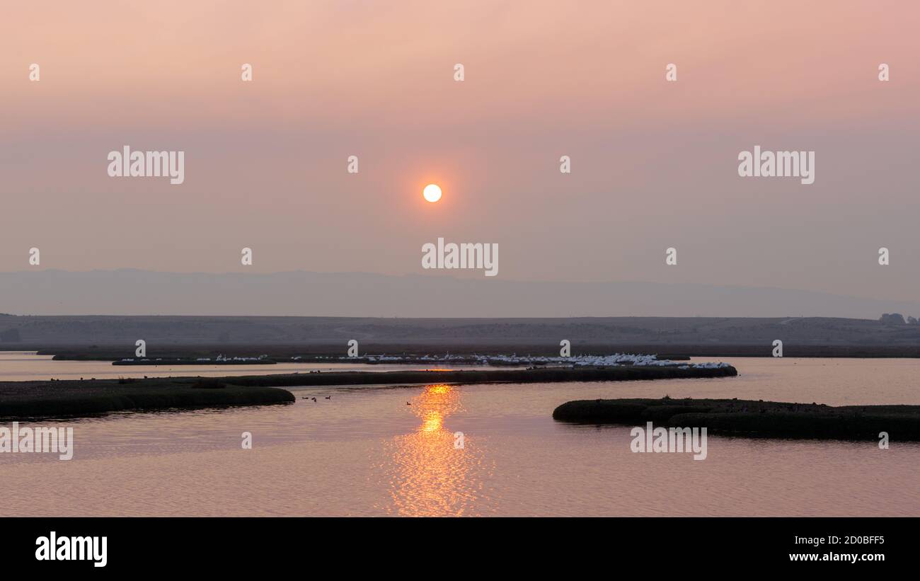 Sun setting behind smoky skies during 2020 California Wildfires Stock Photo