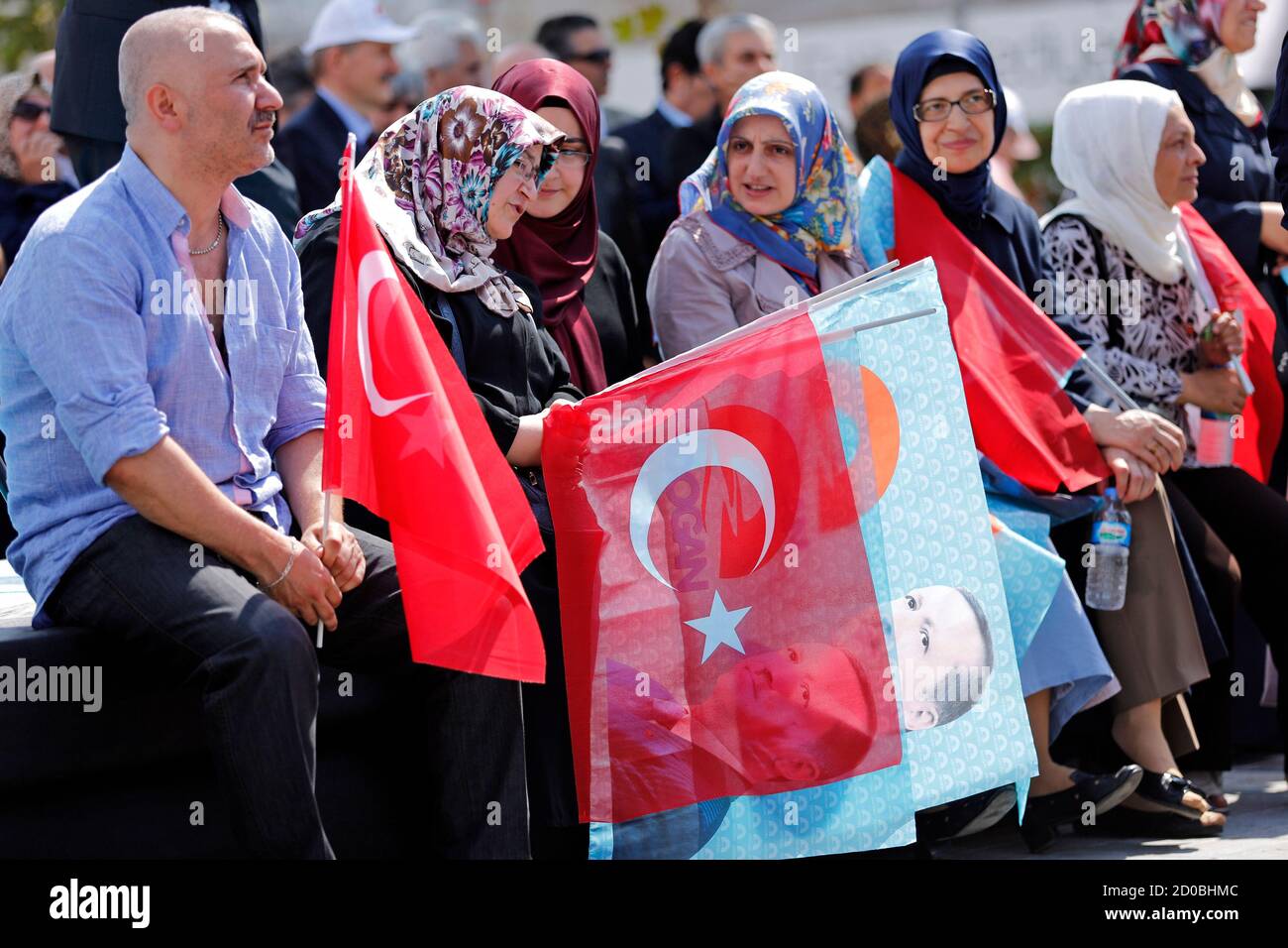 Supporters attend a gathering in support of Turkey's Prime Minister and presidential candidate Tayyip Erdogan in Istanbul August 8, 2014. Erdogan is set to secure his place in history as Turkey's first popularly-elected president on Sunday, but his tightening grip on power has polarised the nation, worried Western allies and raised fears of creeping authoritarianism. REUTERS/Murad Sezer (TURKEY  - Tags: POLITICS ELECTIONS) Stock Photo
