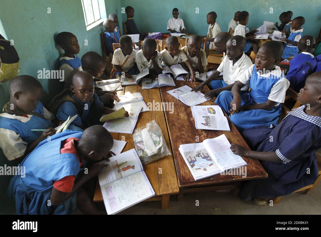 Pupils attend a class session at the Senator Obama primary school in the U.S. President Barack Obama's ancestral village of Nyang'oma Kogelo, west of Kenya's capital Nairobi, July 16, 2015. Obama visits Kenya and Ethiopia in July, his third major trip to Sub-Saharan Africa after travelling to Ghana in 2009 and to Tanzania, Senegal and South Africa in 2011. He has also visited Egypt, in North Africa, and South Africa for Nelson Mandela's funeral. Obama will be welcomed by a continent that had expected closer attention from a man they claim as their son, a sentiment felt acutely in the Kenyan vi Stock Photo