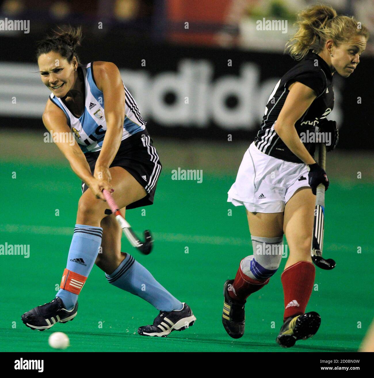 Argentina S Noel Barrionuevo L Hits The Ball Past Germany S Lydia Hasse During Their Match At The Four Nations Women S Hockey Field Tournament In Mendoza February 10 2011 Reuters Enrique Marcarian Argentina Tags Sport