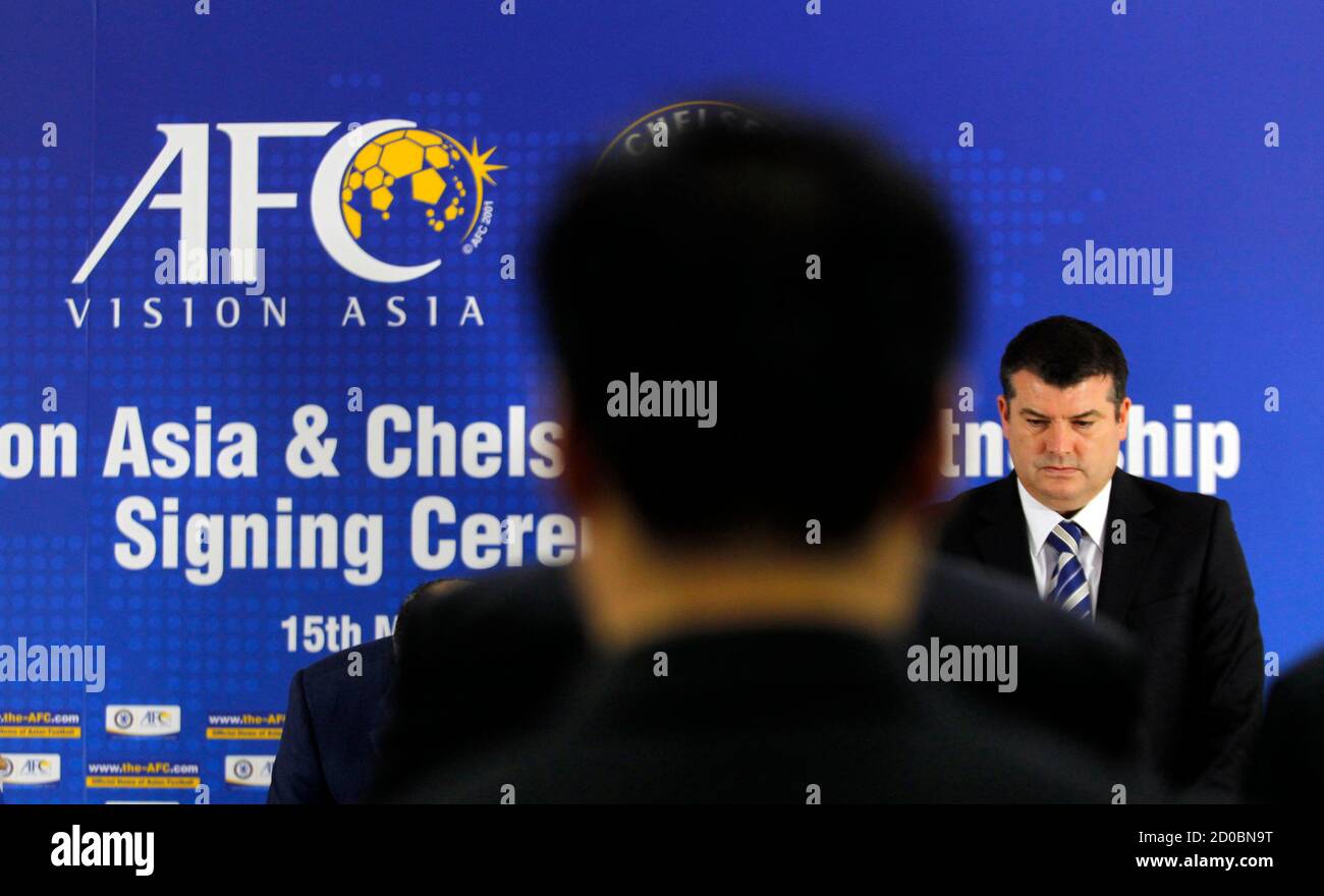 English Premier League Club Chelsea Fc S Chief Executive Ron Gourlay Stands For A Minute Of Silence To Commemorate Victims Of The Earthquake And Tsunami That Hit Japan On Friday Before The Signing English Premier League Club Chelsea Fc S Chief Executive Ron Gourlay Stands For A Minute Of Silence To Commemorate Victims Of The Earthquake And Tsunami That Hit Japan On Friday Before The Signing
