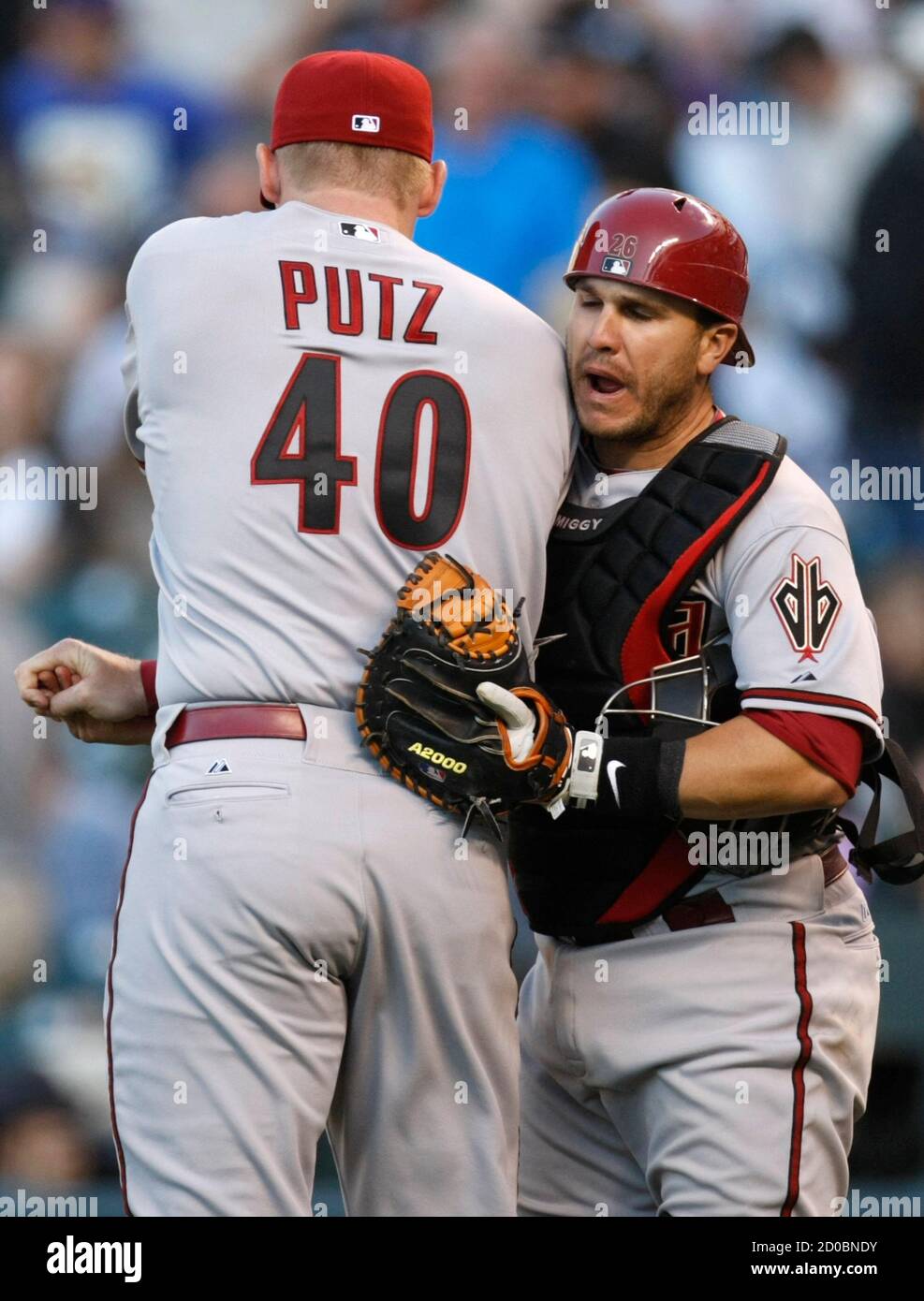 Arizona Diamondbacks closing pitcher J.J. Putz (40) celebrates with Diamondbacks catcher Miguel Montero after they defeated the Colorado Rockies in their MLB National League baseball opening day game in Denver April 1, 2011. REUTERS/Rick Wilking (UNITED STATES - Tags: SPORT BASEBALL) Stock Photo