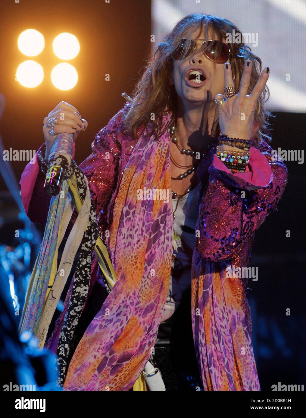 Steven Tyler, the lead singer of rock band Aerosmith, performs during a  concert on the first stop of their Latin America tour at the Jockey Club in  Asuncion October 26, 2011. Tyler,