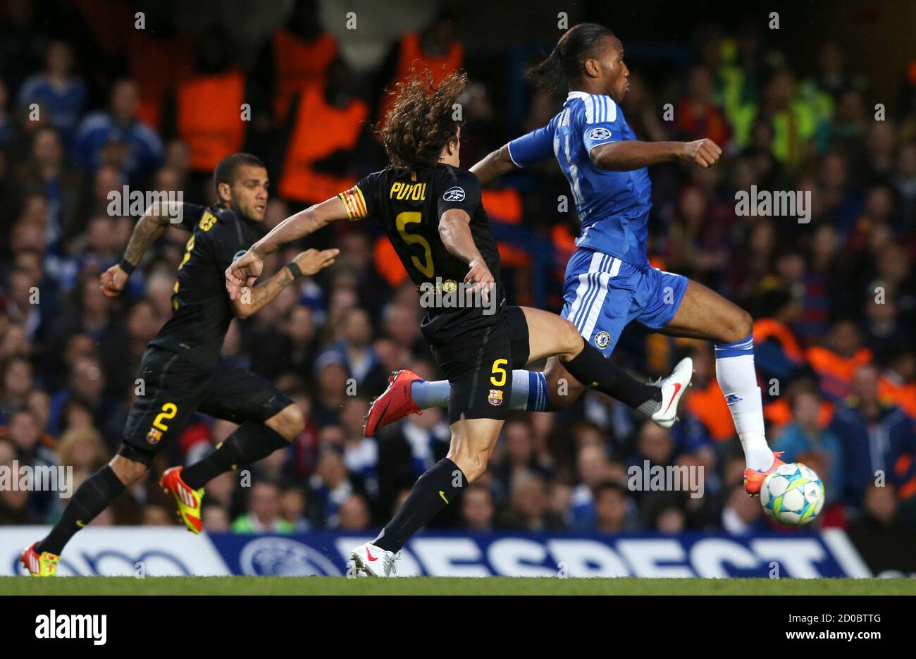 Carles Puyol C Of Barcelona And Didier Drogba R Of Chelsea Chase The Ball During Their Champions League Semi Final First Leg Soccer Match At Stamford Bridge In London April 18 12 Reuters Eddie