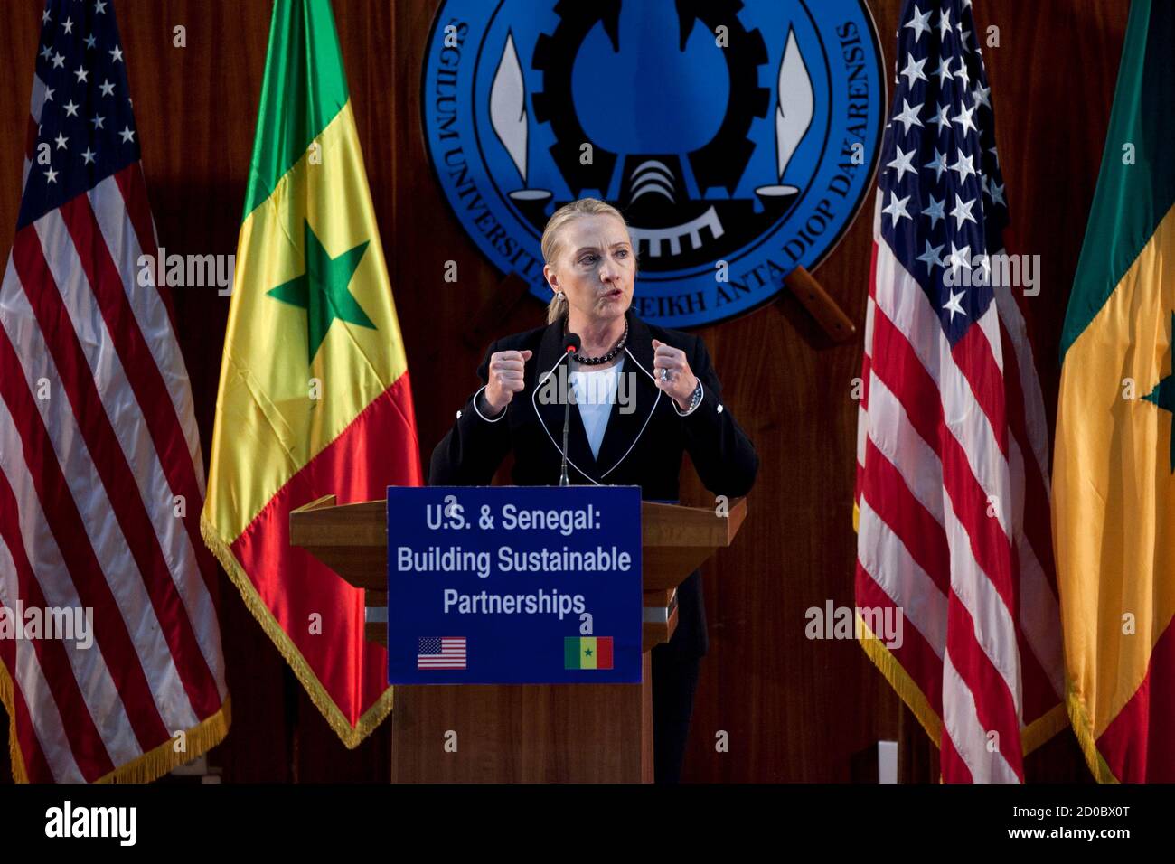 U.S. Secretary of State Hillary Clinton speaks at the University of Dakar in Senegal, August 1, 2012. Clinton urged Africa on Wednesday to recommit to democracy, declaring the 'old ways of governing' can no longer work on a continent boasting healthy economic growth and an increasingly empowered citizenry. REUTERS/Joe Penney (SENEGAL - Tags: POLITICS) Stock Photo