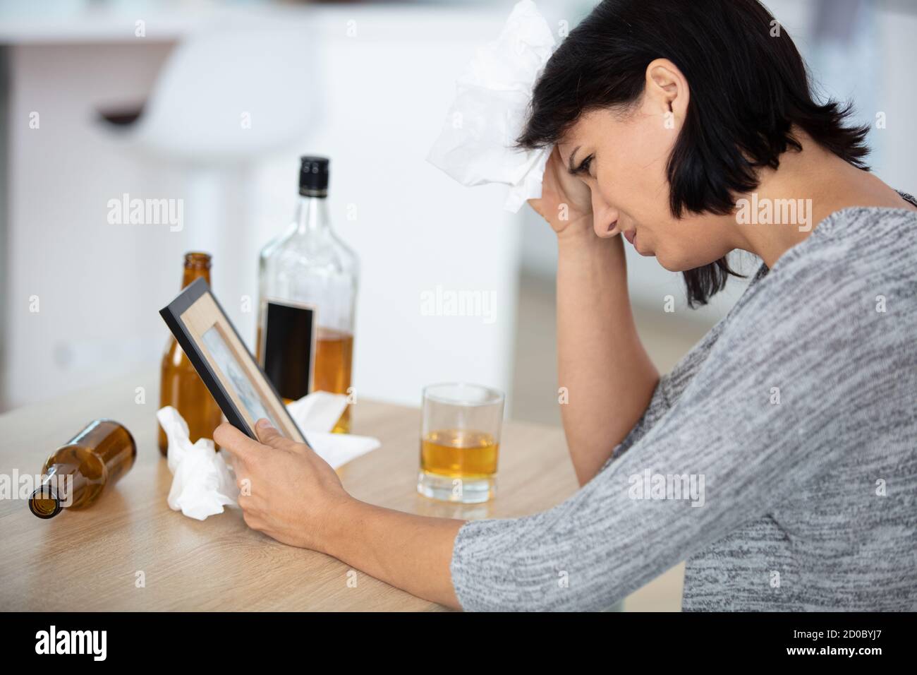 depressed woman having problems with alcohol Stock Photo