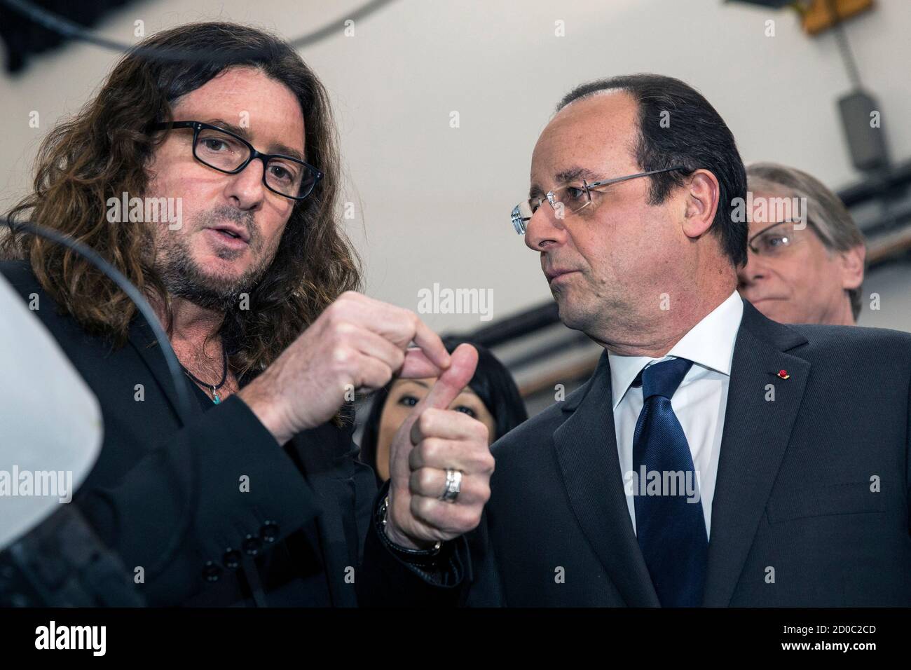 Jacques-Antoine Granjon (L), the founder and CEO of Vente-Privee.com,  escorts French President Francois Hollande during a visit to its  headquarter in Paris, France, February 6, 2014. REUTERS/Etienne  Laurent/Pool (FRANCE - Tags: BUSINESS