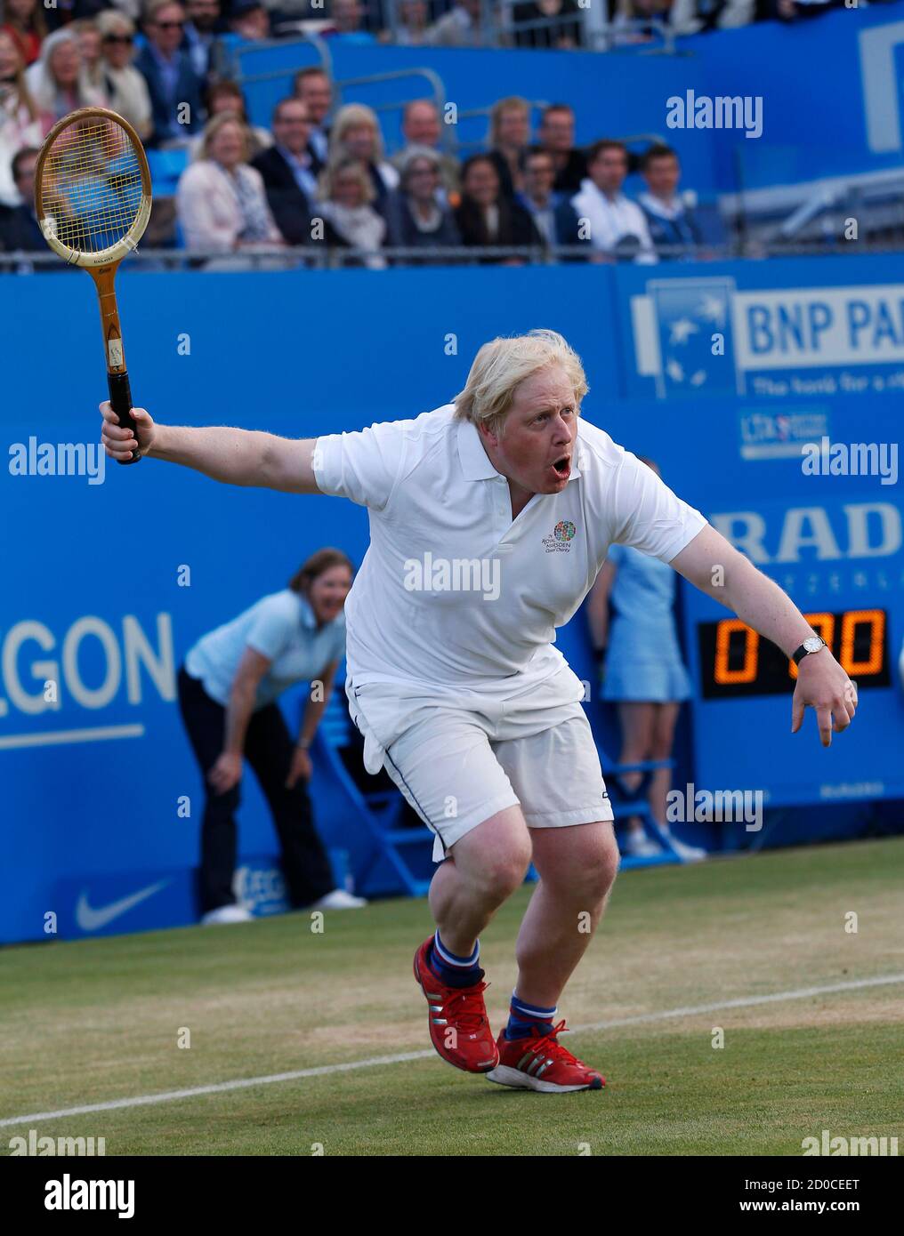 London Mayor Boris Johnson takes part in a charity game of tennis at the  Queen's Club in west London June 16, 2013. REUTERS/Eddie Keogh (BRITAIN -  Tags: SPORT TENNIS POLITICS SOCIETY ENTERTAINMENT