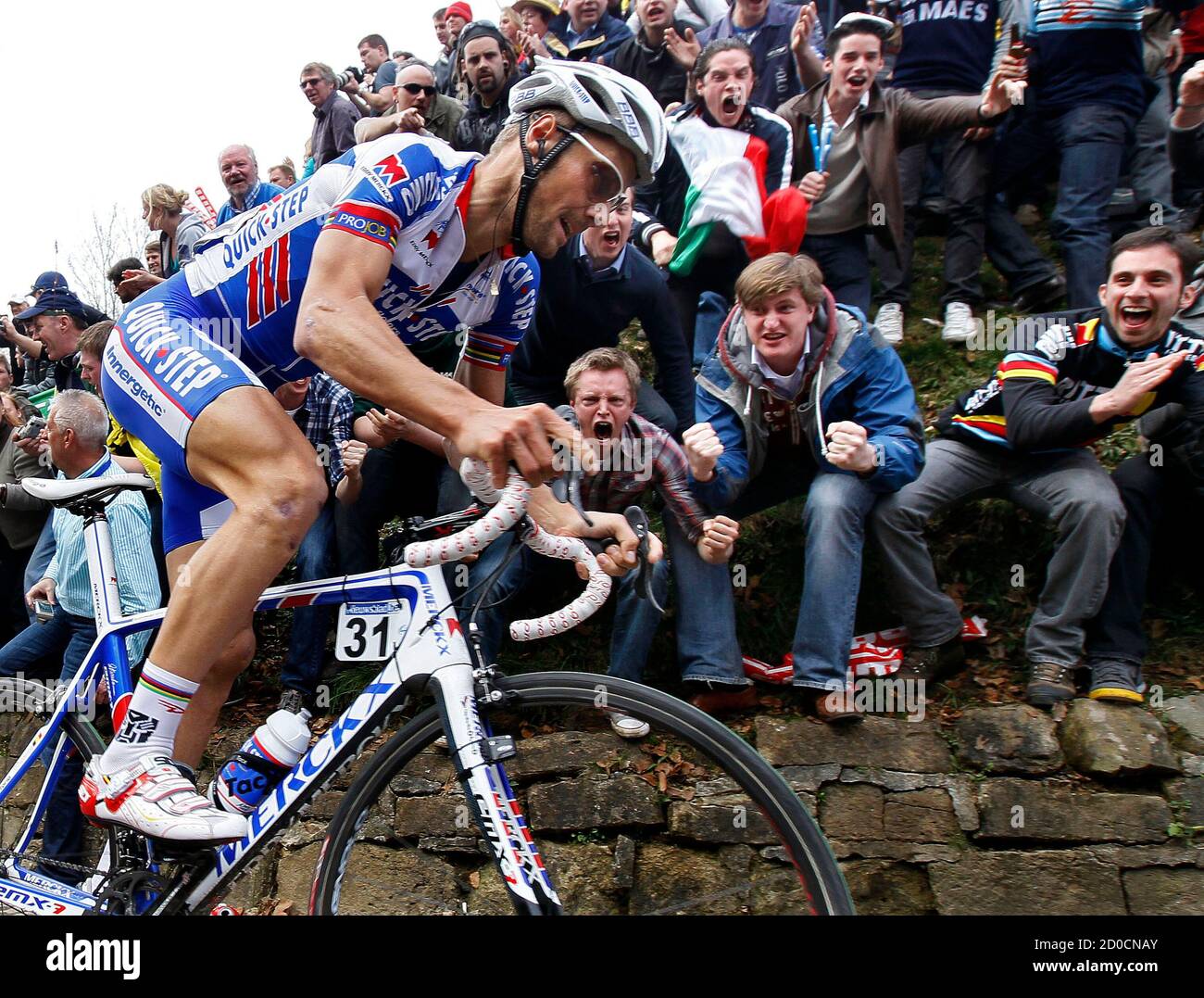 Quick Step rider Tom Boonen of Belgium climbs the ...