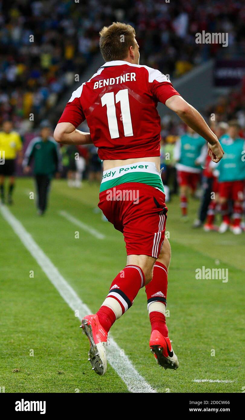 Denmark's striker Nicklas Bendtner runs on the pitch displaying the name of  Irish bookmaking firm Paddy Power on the waistband of his underpants during  their Group B Euro 2012 soccer match against