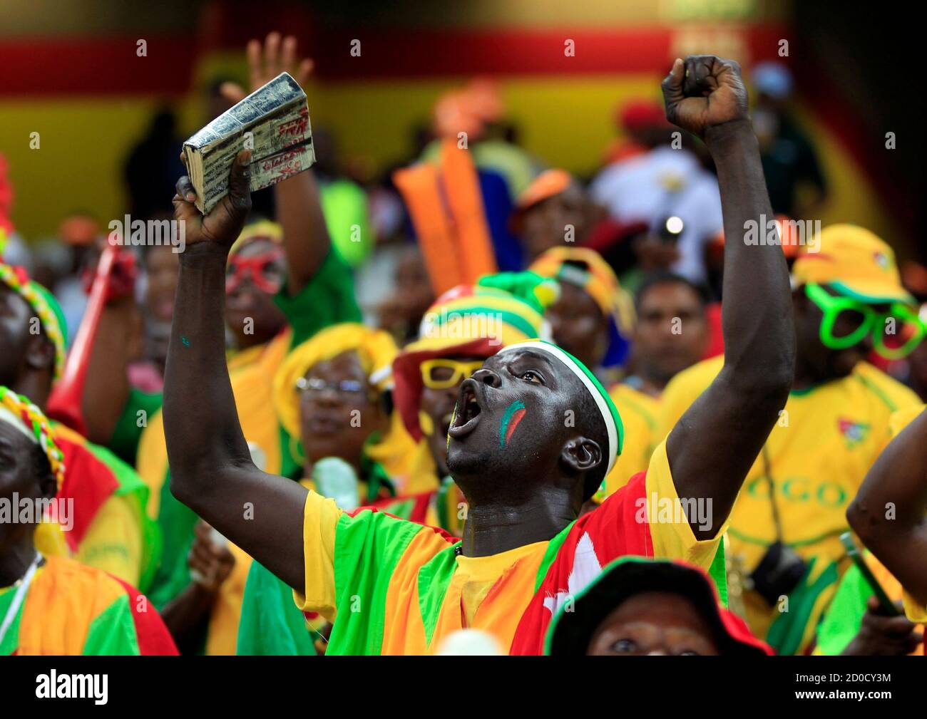 Supporters of Burkina Faso cheer during their African Cup of Nations (AFCON 2013) quarter-final soccer match against Togo at the Mbombela Stadium in Nelspruit, February 3, 2013. REUTERS/Thomas Mukoya (SOUTH AFRICA - Tags: SPORT SOCCER) Stock Photo