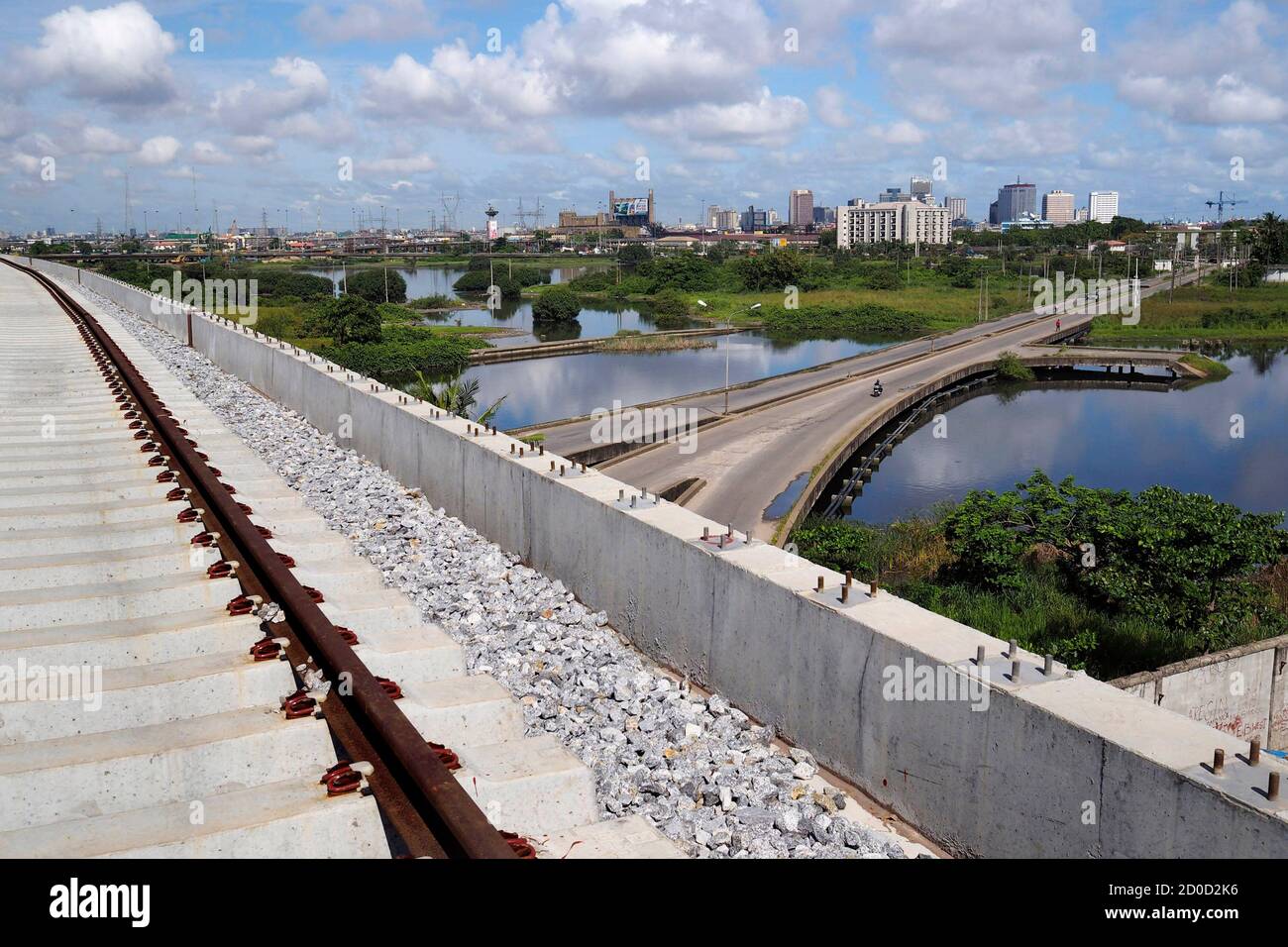 Train tracks are seen at the National Arts Theatre stop of the light rail system under construction in Lagos, Nigeria, May 30, 2014. Started in 2009 to ease traffic, Lagos state government is building a rail system with the China Civil Engineering Construction Corporation. The first test runs should start in 2015, according to an official at the National Arts Theatre work site. REUTERS/Joe Penney (NIGERIA - Tags: BUSINESS CONSTRUCTION TRANSPORT POLITICS) Stock Photo