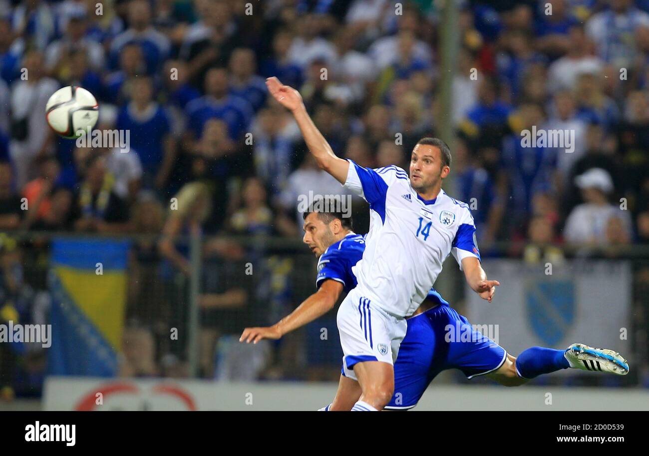 Bosnia S Emir Spahic Fights For The Ball Against Israel S Ben Sahar R During Their Euro 16 Qualifying Soccer Match In Zenica Bosnia And Herzegovina June 12 15 Reuters Dado Ruvic Stock Photo Alamy