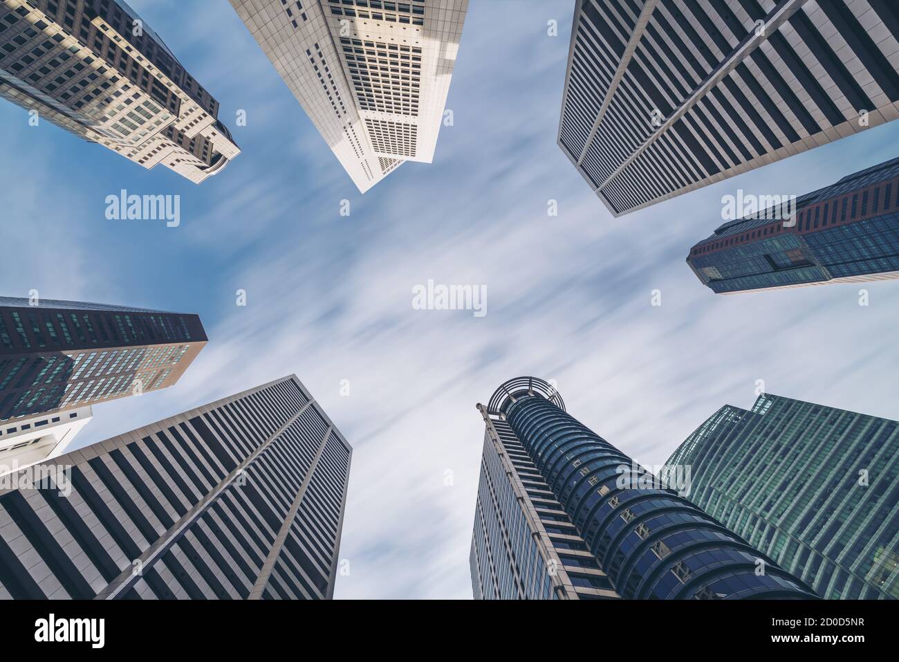 Business buildings skyline looking up with blue sky. Business downtown and skyscrapers, high-rise buildings, modern architecture buildings. Stock Photo