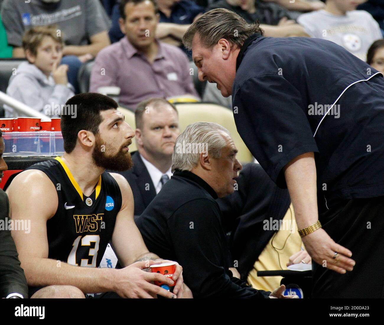 West Virginia coach Bob Huggins (R) yells at Deniz Kilicli (13) in the  first half of their NCAA men's college basketball game against Gonzaga  University in Pittsburgh, Pennsylvania, March 15, 2012. REUTERS/Jason