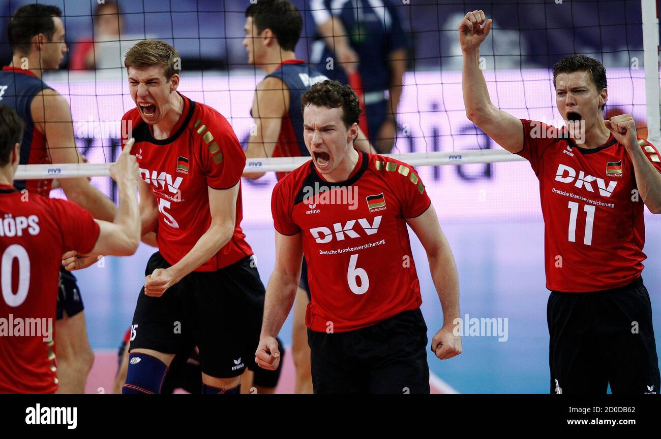 Lukas Kampa (R-L), Denys Kaliberda, Max Gunthor and Jochen Schops of  Germany celebrate a point against the U.S. during their FIVB World League  Finals Pool E men's volleyball match at Arena Armeec