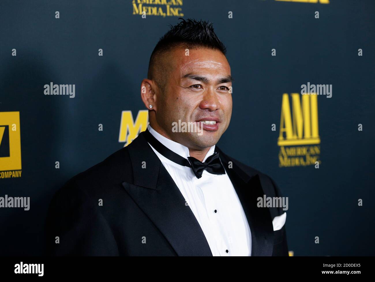 Professional bodybuilder Hidetada Yamagishi poses at the Los Angeles premiere of the documentary film 'Generation Iron' in Hollywood, California September 18, 2013. The film examines the professional sport of bodybuilding today. REUTERS/Danny Moloshok (UNITED STATES - Tags: ENTERTAINMENT HEADSHOT SPORT) Stock Photo