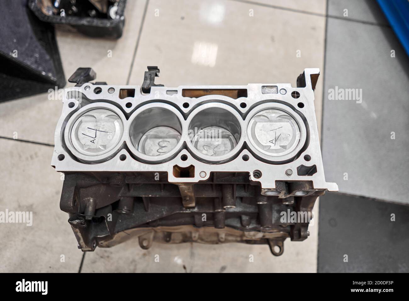 New pistons and cylinder head of engine block vehicle. Motor capital  repair. Sixteen valve and four cylinder. Car service concept. The job of a  Stock Photo - Alamy