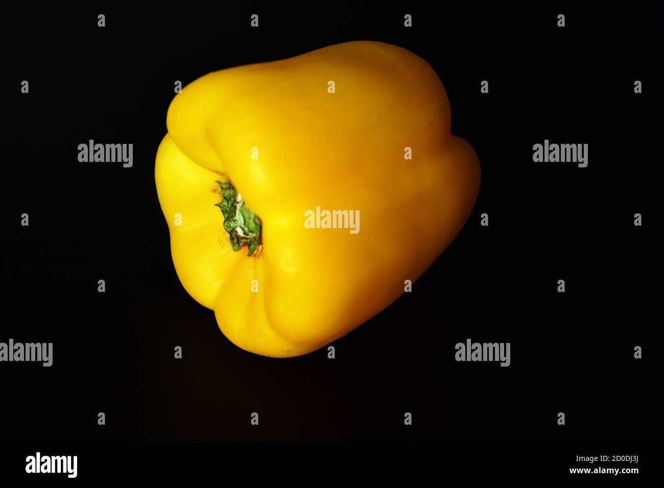 Image of sweet yellow paprika pepper isolated on black background Stock