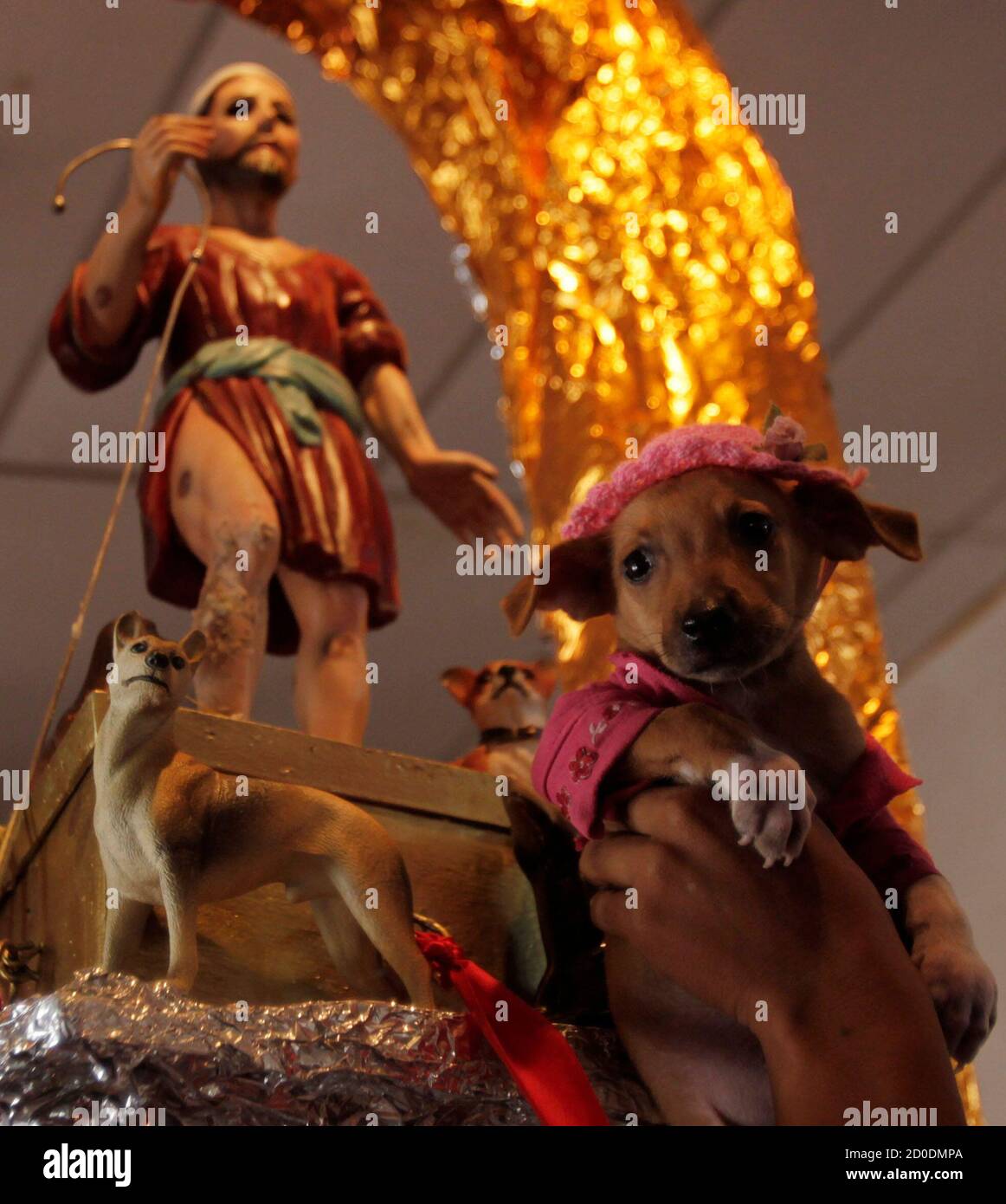 A Parishioner Presents His Dog To The Image Of San Lazaro Saint Lazarus During A Mass In His Honor At The Maria Magdalena Church In The Indigenous Community Of Monimbo In Masaya