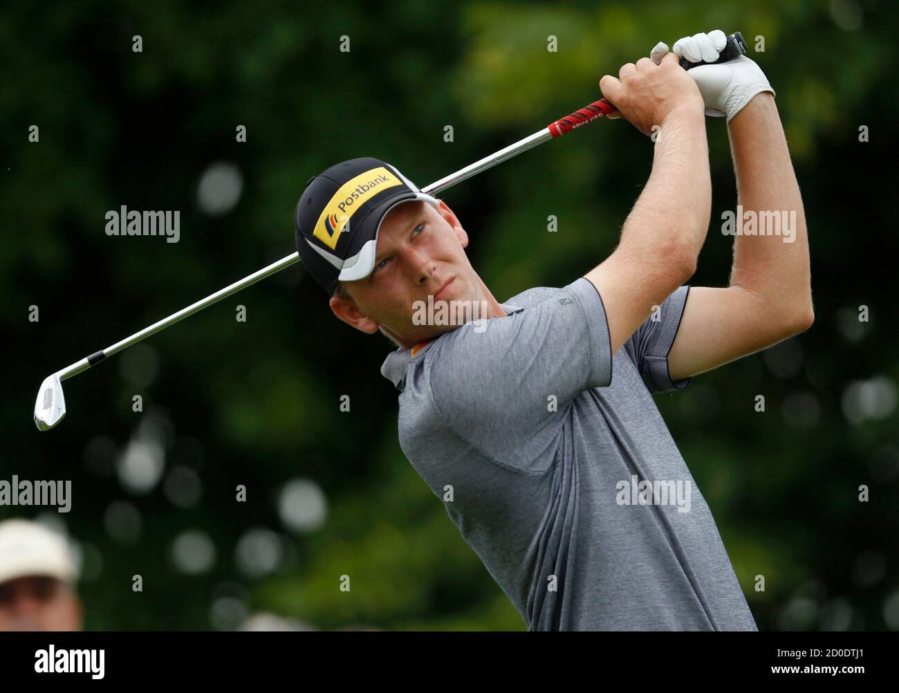 Germany's Marcel Siem tees off a ball at the third hole during the first  day of the International Golf Open in Pulheim near Cologne June 21, 2012.  REUTERS/Ina Fassbender (GERMANY - Tags: