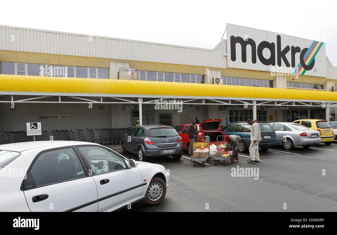 Shoppers Load Their Goods Into A Car Outside A Makro Branch Of South African Retailer Massmart In Cape Town May 31 2011 South Africa Approved Wal Mart S 2 4 Billion Bid For Control Of
