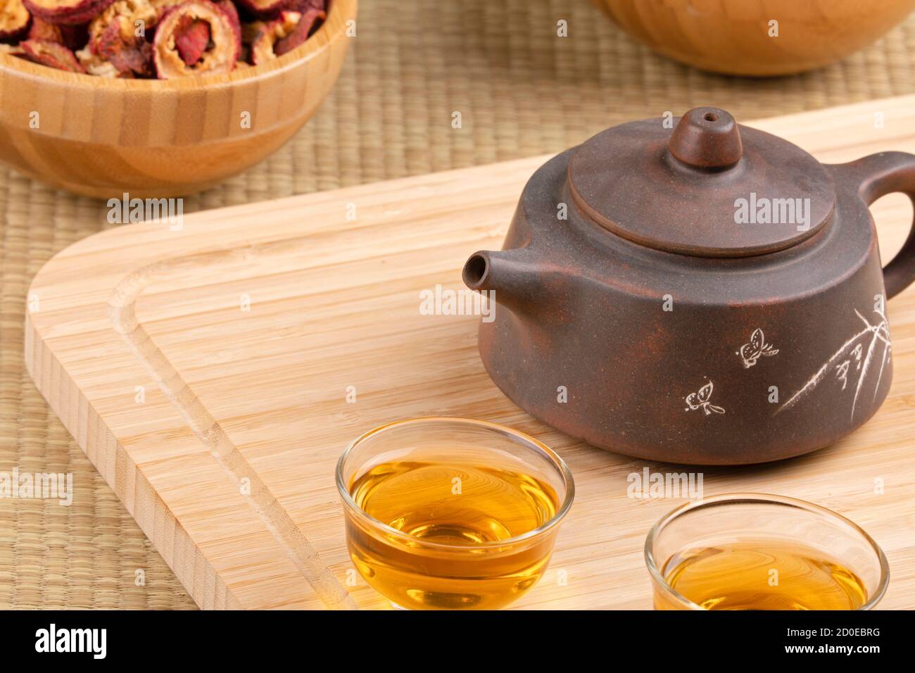 Close up of traditional Chinese tea pot and Hawthorn Fruit tea isolated on wooden background Stock Photo