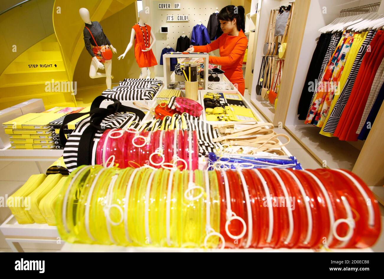 A clerk works at Kate Spade's new Saturday label store in Tokyo March 21,  2013. Kate Spade Saturday opened its first store in Tokyo's trendy Harajuku  district earlier this month and another