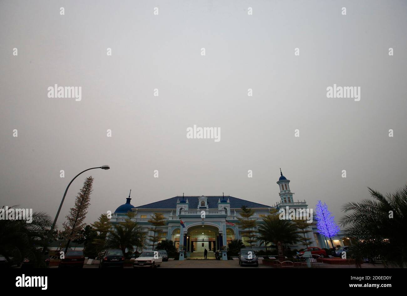 A Muslim Man Arrives For Sunset Prayers At The Sultan Ibrahim Mosque Amid The Haze In Muar In Malaysia S Southern State Of Johor Bordering Singapore June 20 2013 Singapore S Air Quality Deteriorated