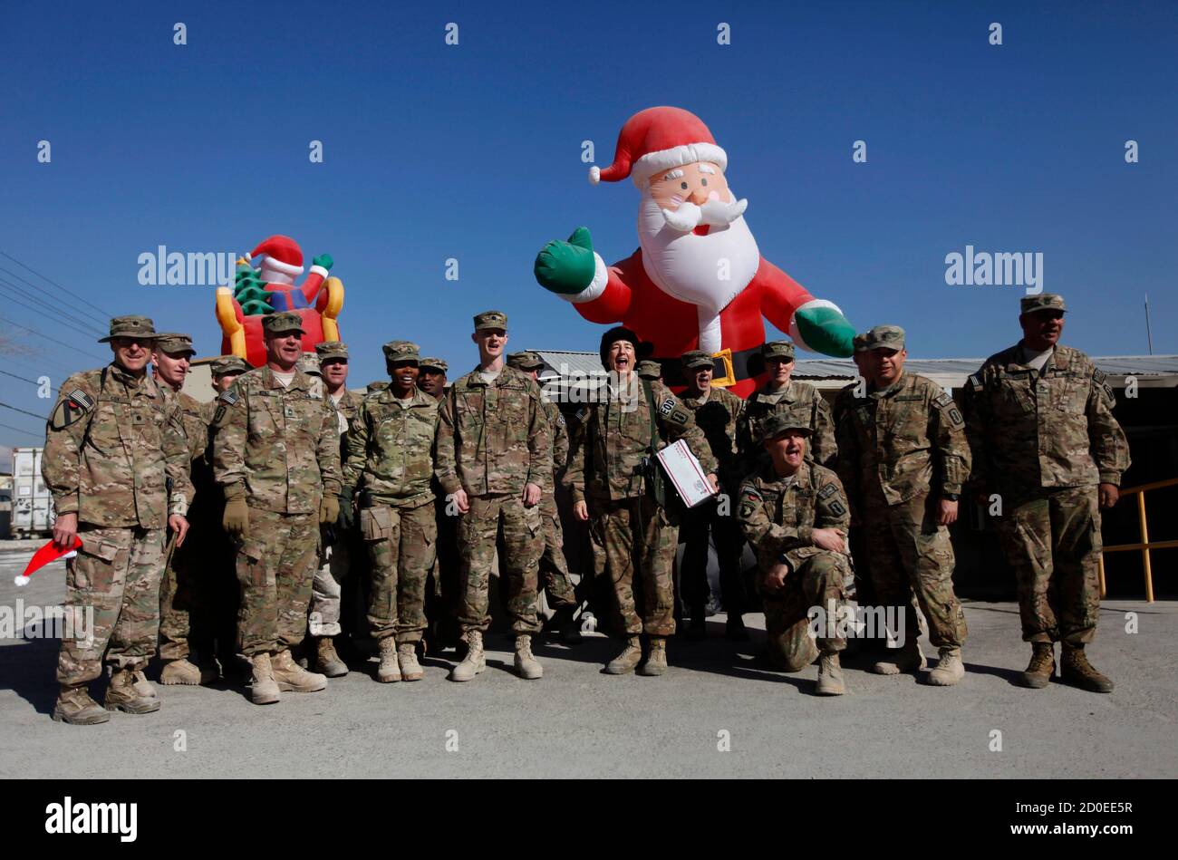 NATO troops from the International Security Assistance Force (ISAF) pose for pictures during Christmas celebrations at Bagram Airfield, north of Kabul, December 25, 2013. REUTERS/Mohammad Ismail (AFGHANISTAN - Tags: MILITARY SOCIETY) Stock Photo