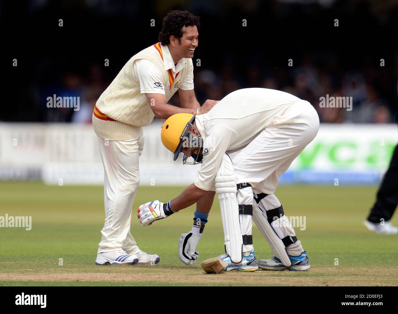 Mcc S Captain Sachin Tendulkar Smiles As Rest Of The World S Yuvraj Singh Attempts To Grab His Leg During A Cricket Match To Celebrate 200 Years Of Lord S At Lord S Cricket Ground In