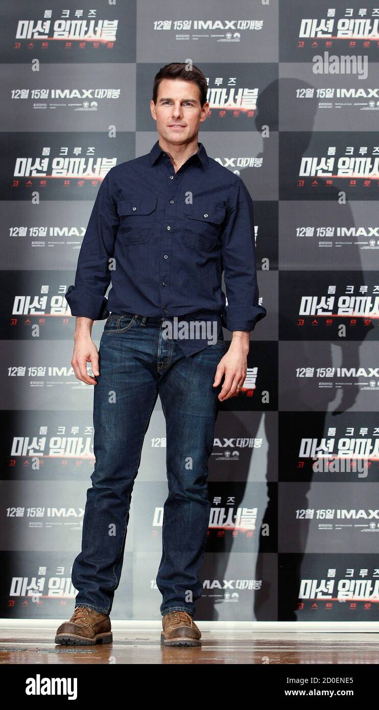 Tom Cruise poses for the media after a news conference promoting his latest  film \