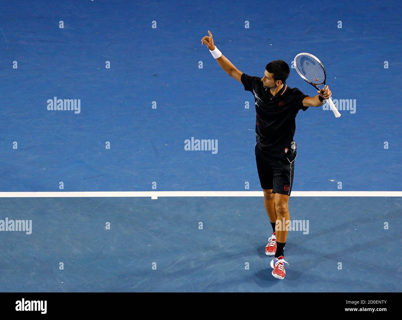 Drama Arbejdsløs Instrument Novak Djokovic of Serbia celebrates defeating Lleyton Hewitt of Australia  at the Australian Open tennis tournament in Melbourne January 23, 2012.  REUTERS/Mark Blinch (AUSTRALIA - Tags: SPORT TENNIS Stock Photo - Alamy