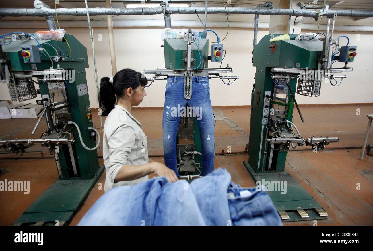 An employee works in Staff Jeans and Co's sewing factory in the town of  Rakovski, some 160 km (99miles) east of Sofia May 18, 2012. Business in Staff  Jeans and Co's main