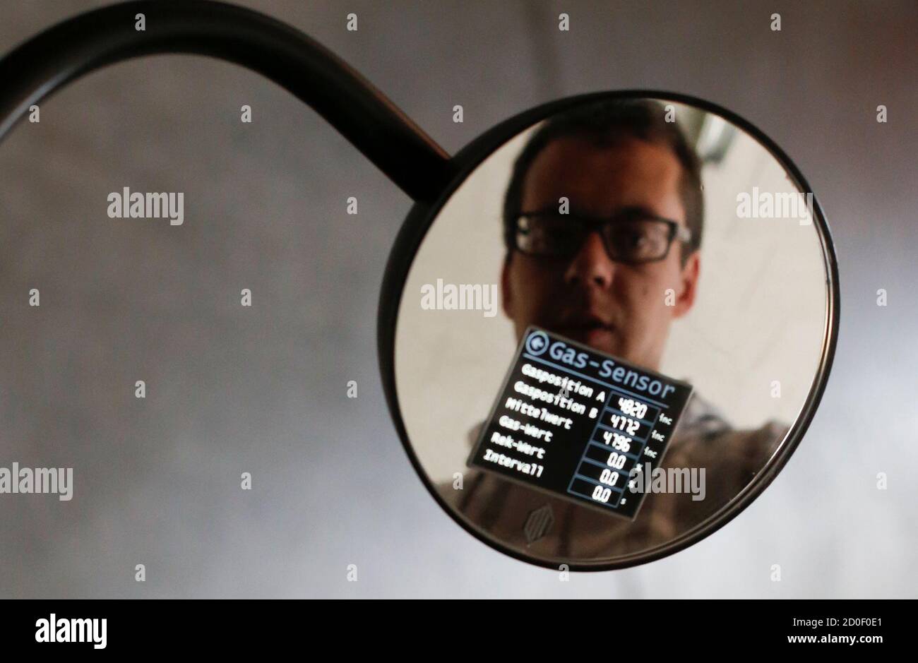 An Employee Of Johammer E Mobility Company Adjusts The Driving Parameters Digital Display In The Rearview Mirror Of A J1 Electro Motorcycle At The Company Headquarters In Bad Leonfelden April 23 14 The