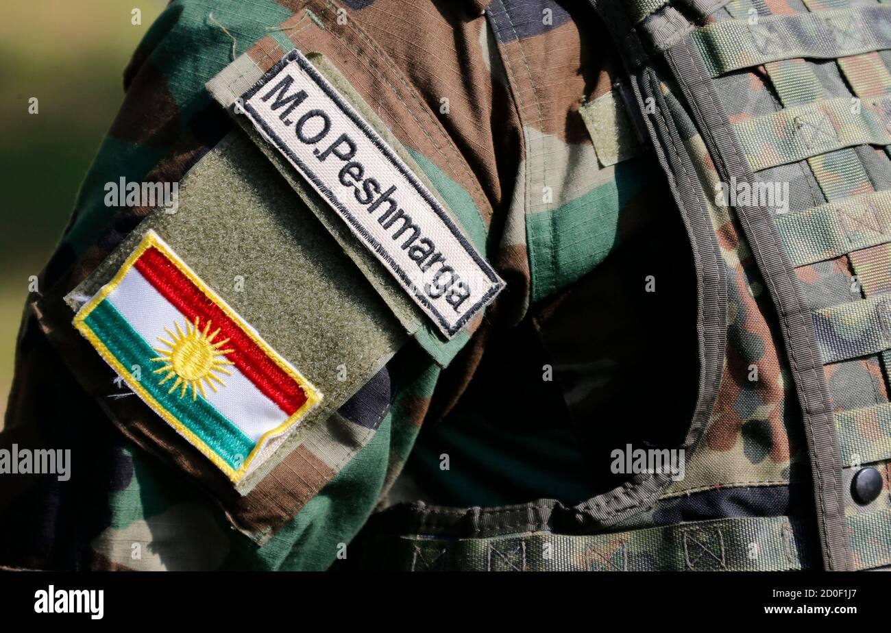 The National Emblem Of Kurdistan Is Seen On The Uniform Of A Peshmerga Fighter During A