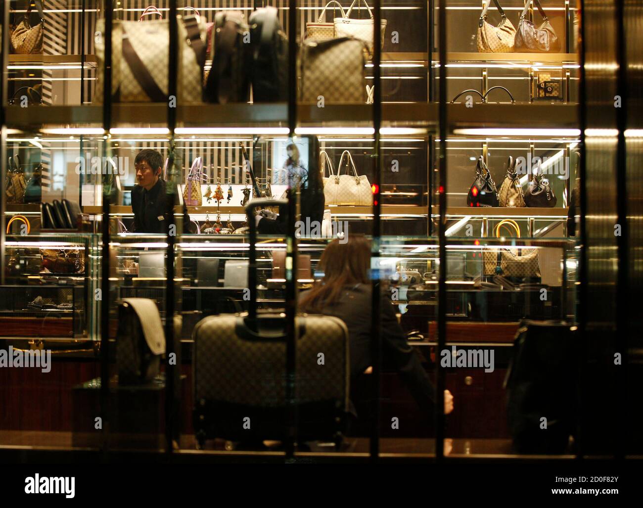 An Employee Of A Luxury Brand Store Is Pictured At A Shopping District In Sendai Miyagi Prefecture Northeastern Japan February 25 12 After The March 11 Tsunami And Earthquake Much Of The