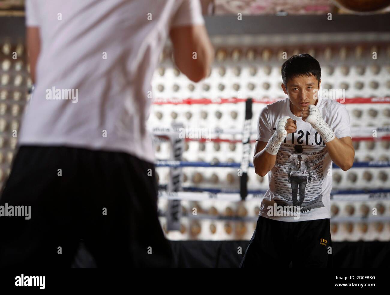 Chinese light flyweight boxer Zou Shiming shadowboxes in a training facility at the Venetian Casino Resort in Las Vegas, Nevada February 8, 2013. Zou, a two-time Olympic gold medalist and three-time world amateur champion, will make his professional debut April 6 at the Venetian Macao Resort in Macau. REUTERS/Steve Marcus (UNITED STATES - Tags: SPORT BOXING) Stock Photo