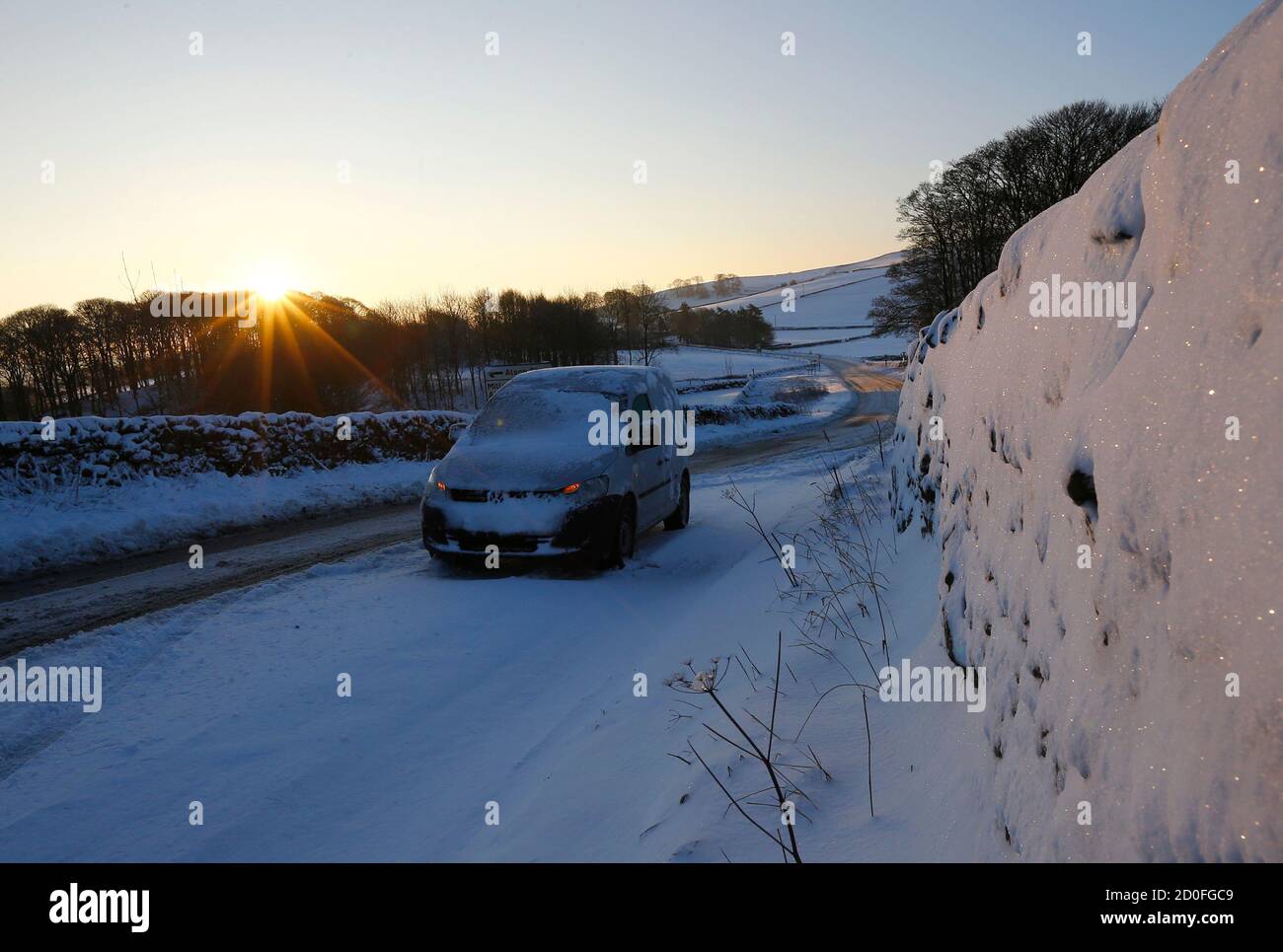 An abandoned car is seen on the A515 after snowfalls near Ashbourne, central England December 27, 2014.  Motorists in the north of Britain were trapped overnight, as a result of heavy snowfalls, local media reported.   REUTERS/Darren Staples   (BRITAIN - Tags: ENVIRONMENT) Stock Photo